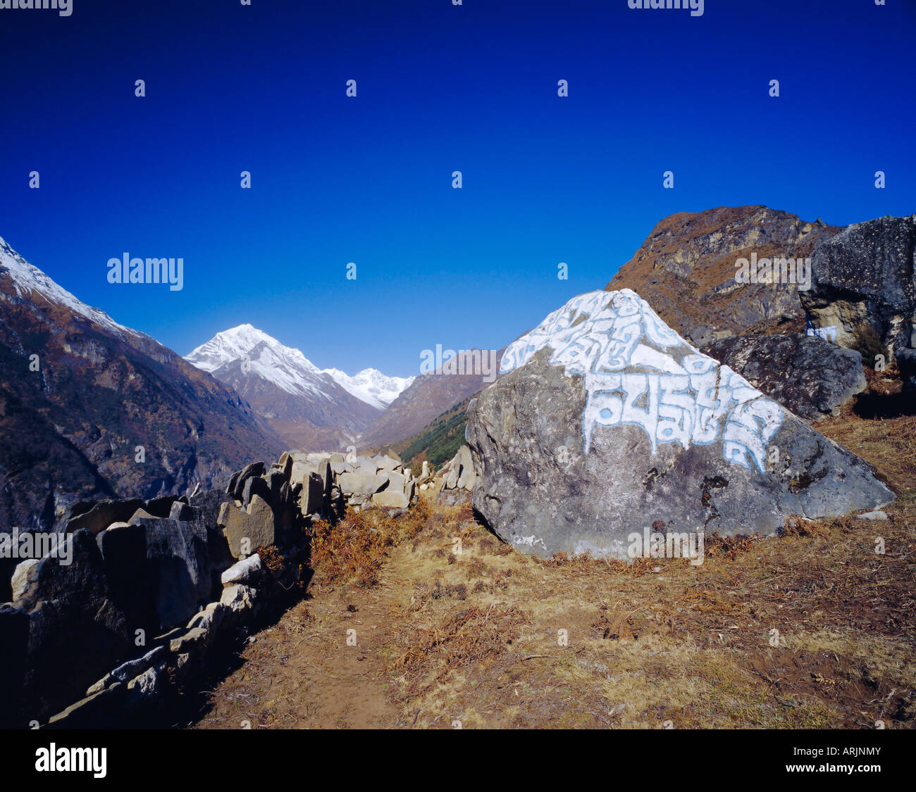 Painted Sutras (Mahayana Buddhist scriptures) on rocks, and mountain ...