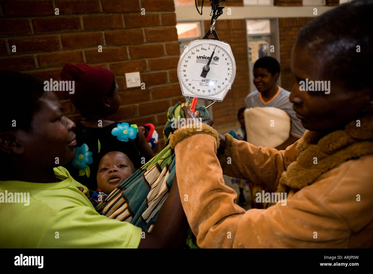 Child being weighed at health clinic, Zomba, Malawi, Africa Stock Photo ...