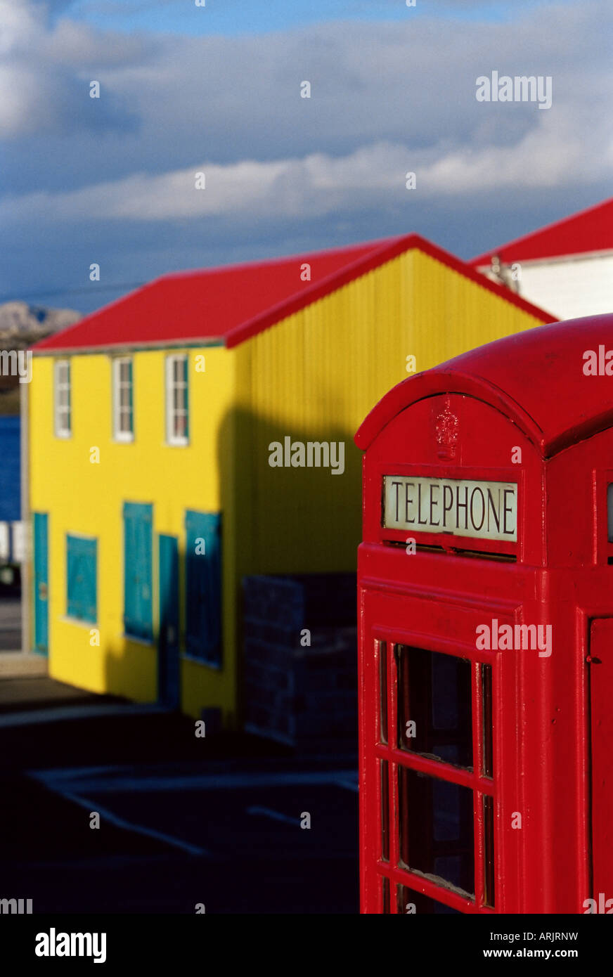 British red telephone box and colourful traditional house, Stanley, East Falkland, Falkland