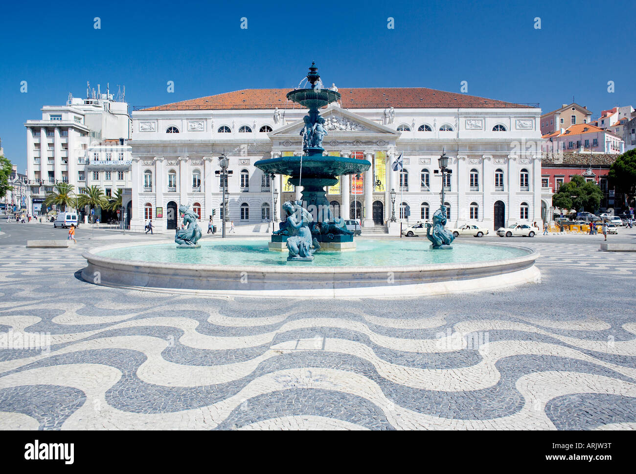 Mosaic paving and fountain with Lisbon Opera House in the background
