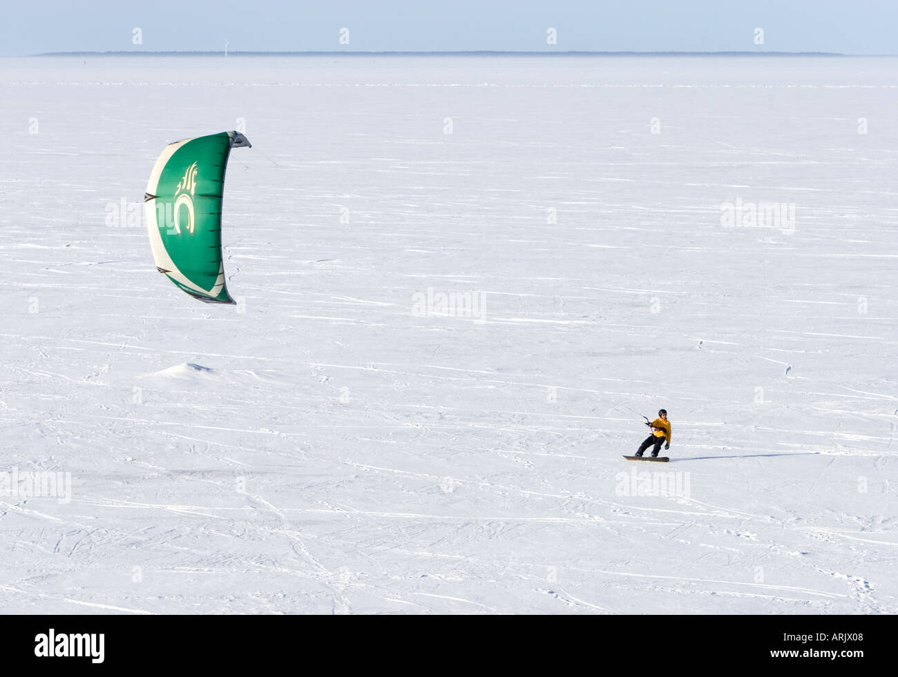Kite boarding on sea ice at Winter at Baltic Sea , Gulf of Bothnia , Oulu , Finland Stock Photo