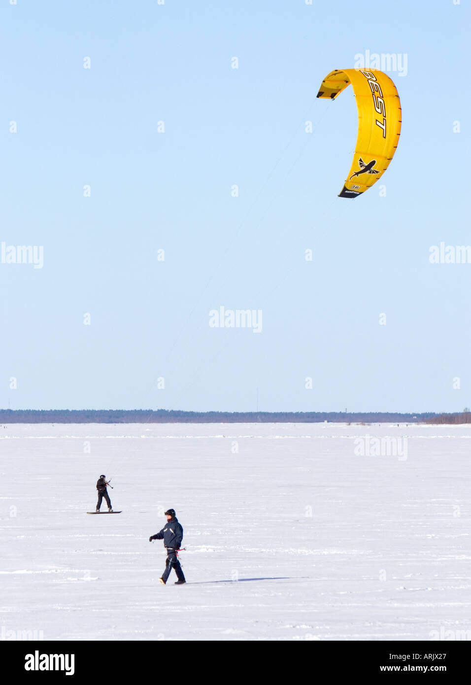 Kite boarding at Winter time on sea ice , Finland , Gulf of Bothnia , Oulu Stock Photo