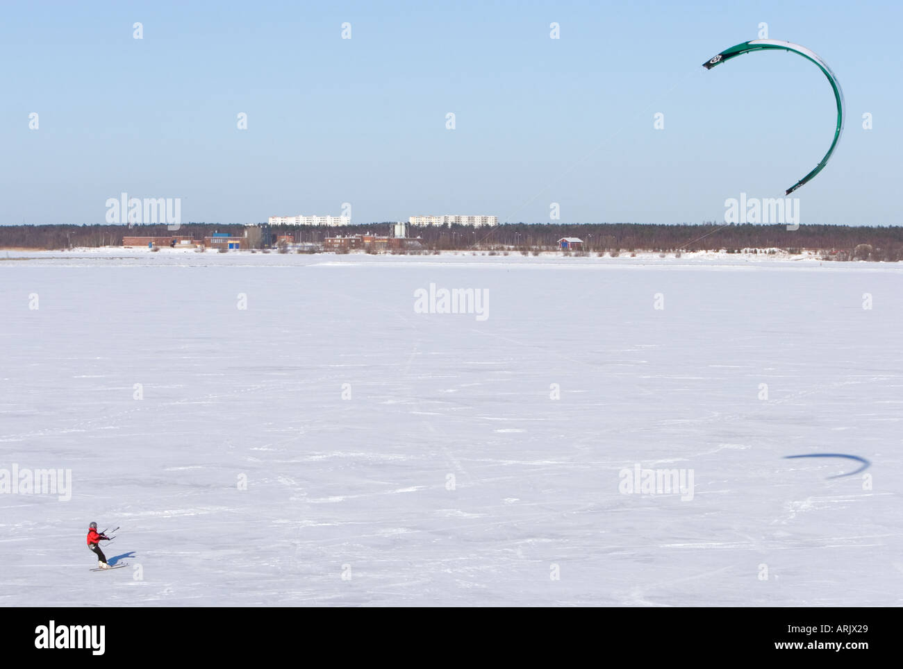 Kite boarding on sea ice at Wintertime , Finland , Gulf of Bothnia , Oulu Stock Photo
