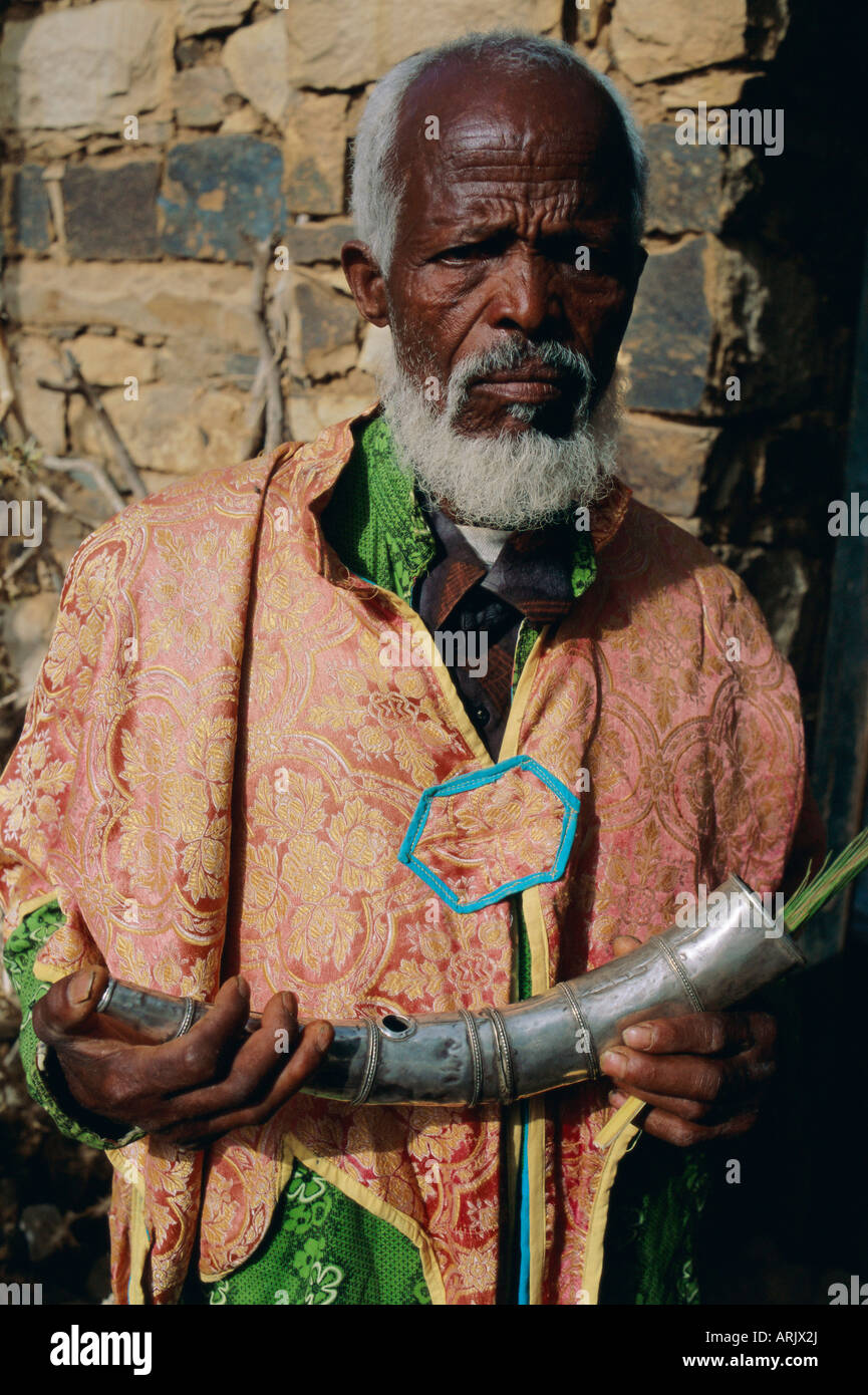 Pilgrim holding an ornamental horn during the festival of Rameaux, Axoum, Ethiopia, Africa Stock Photo