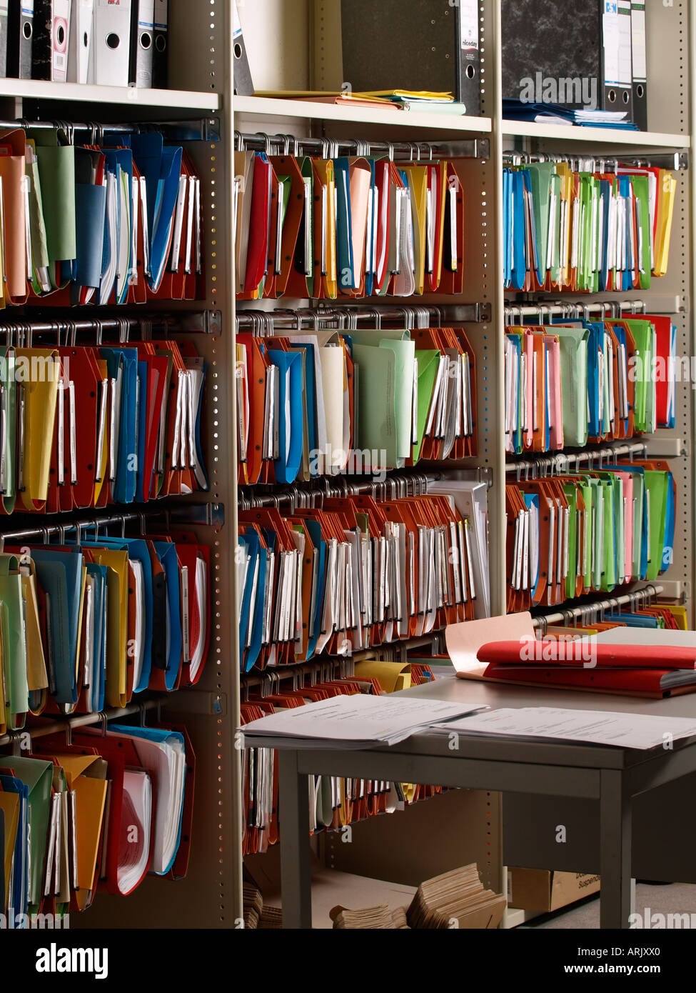 Colourful office archive with many folders and even more files Stock Photo  - Alamy