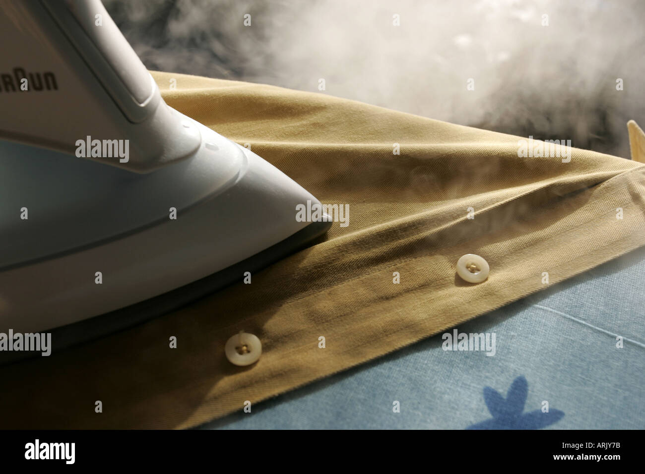DEU, Germany : Iron of laundry at home. Steam iron Stock Photo