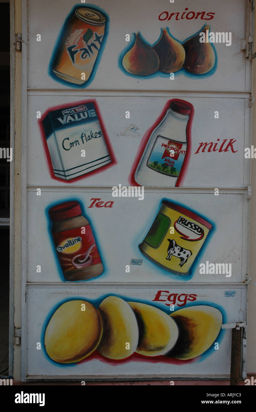Food shop. Art work on a shop front in The Gambia West Africa Advertising the retail sector that the shop belongs to. Stock Photo