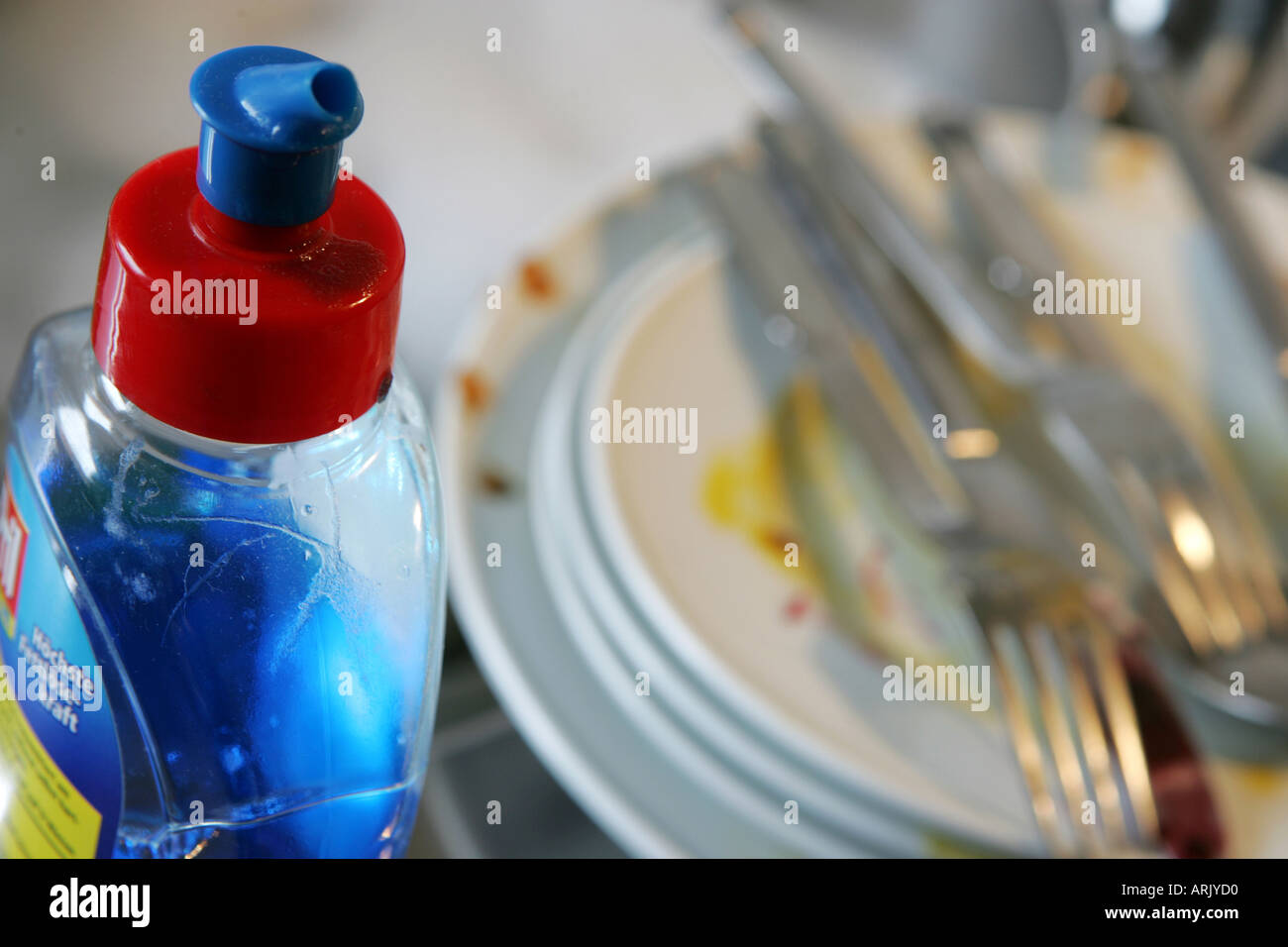 DEU, Germany: Cleaning of dishes by hand in a private kitchen Stock Photo