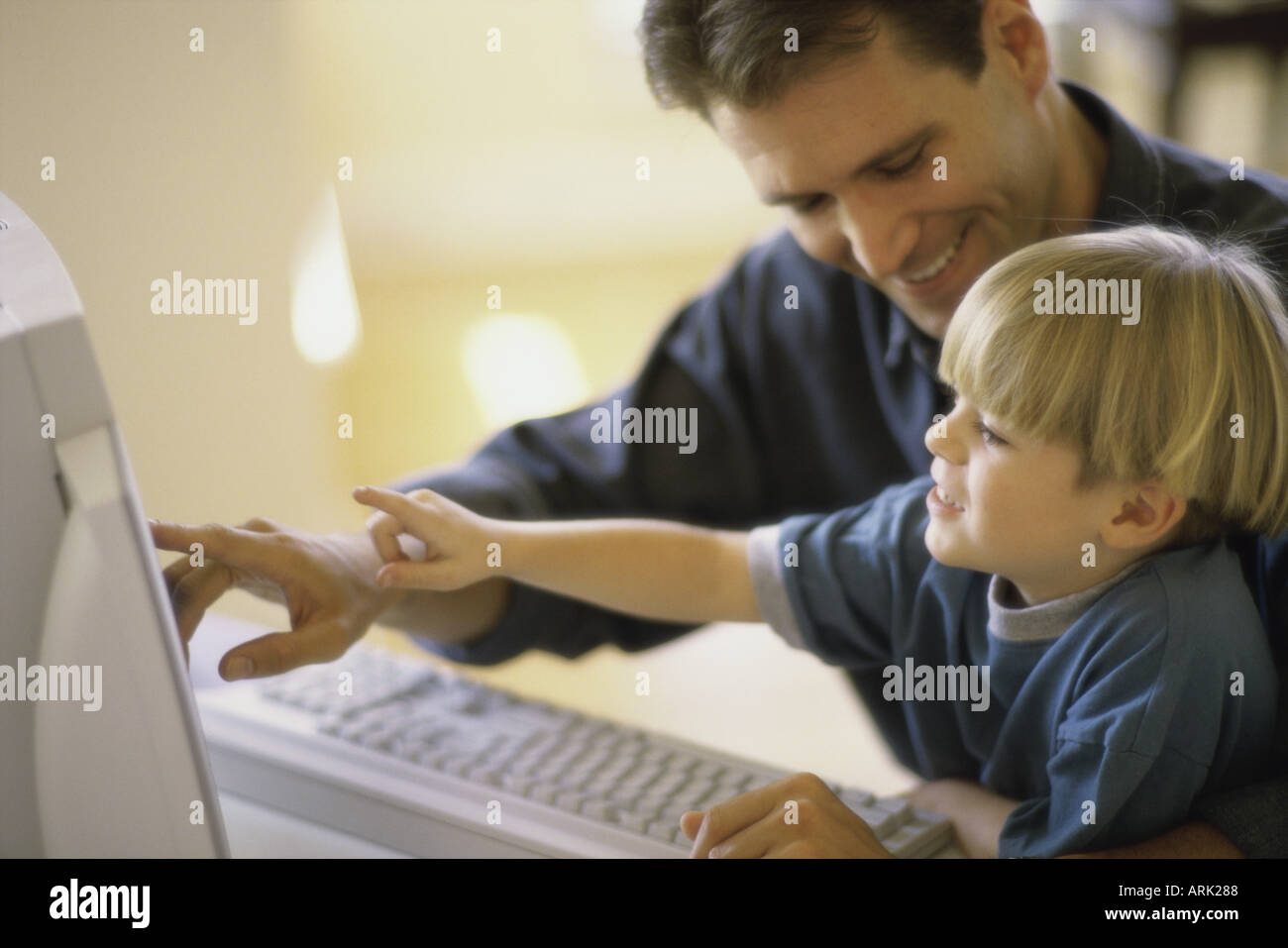 Father son using computers hi-res stock photography and images - Alamy