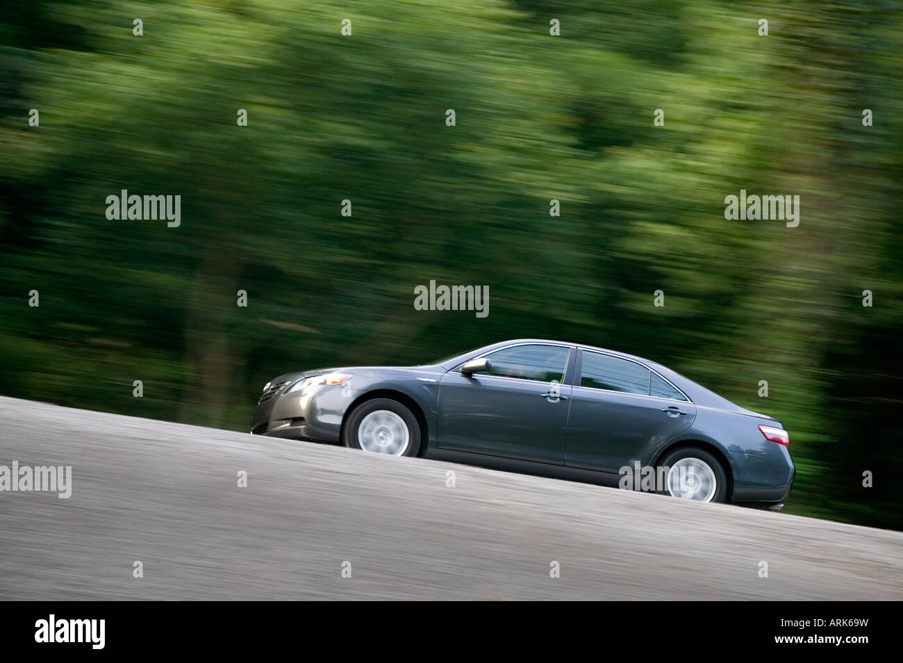 Hybrid car driving at speed Stock Photo