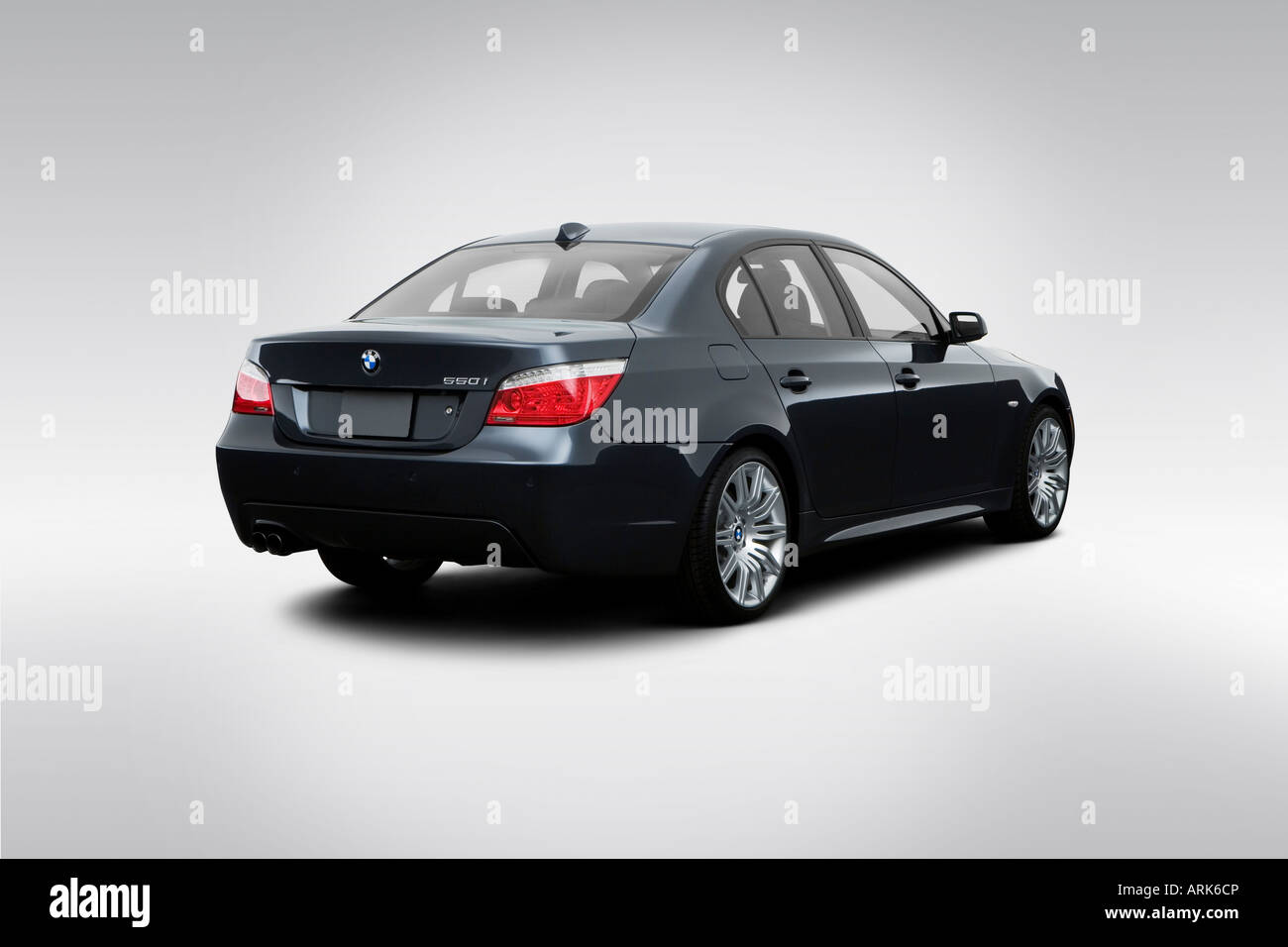 2008 BMW 5-series 550i in Gray - Rear angle view Stock Photo