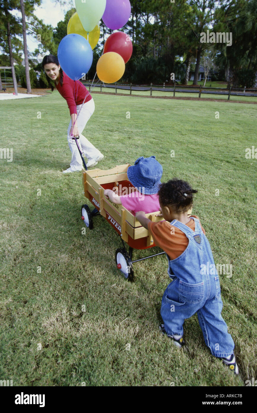 Children pushing pulling wagon hi-res stock photography and images - Alamy