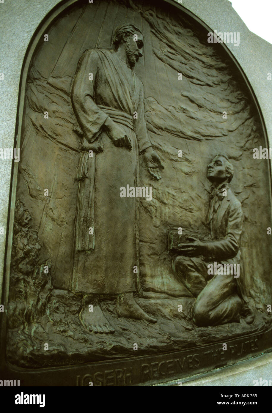 depiction in bronze of Joseph Smith receiving the Golden Plates from The Prophet Moroni at Hill Cumorah Stock Photo