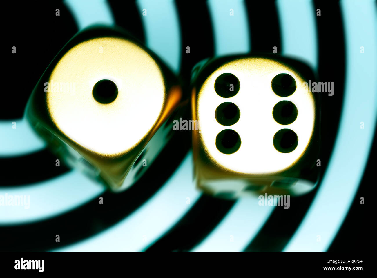 two metal dice on contemporary blue and black background Stock Photo