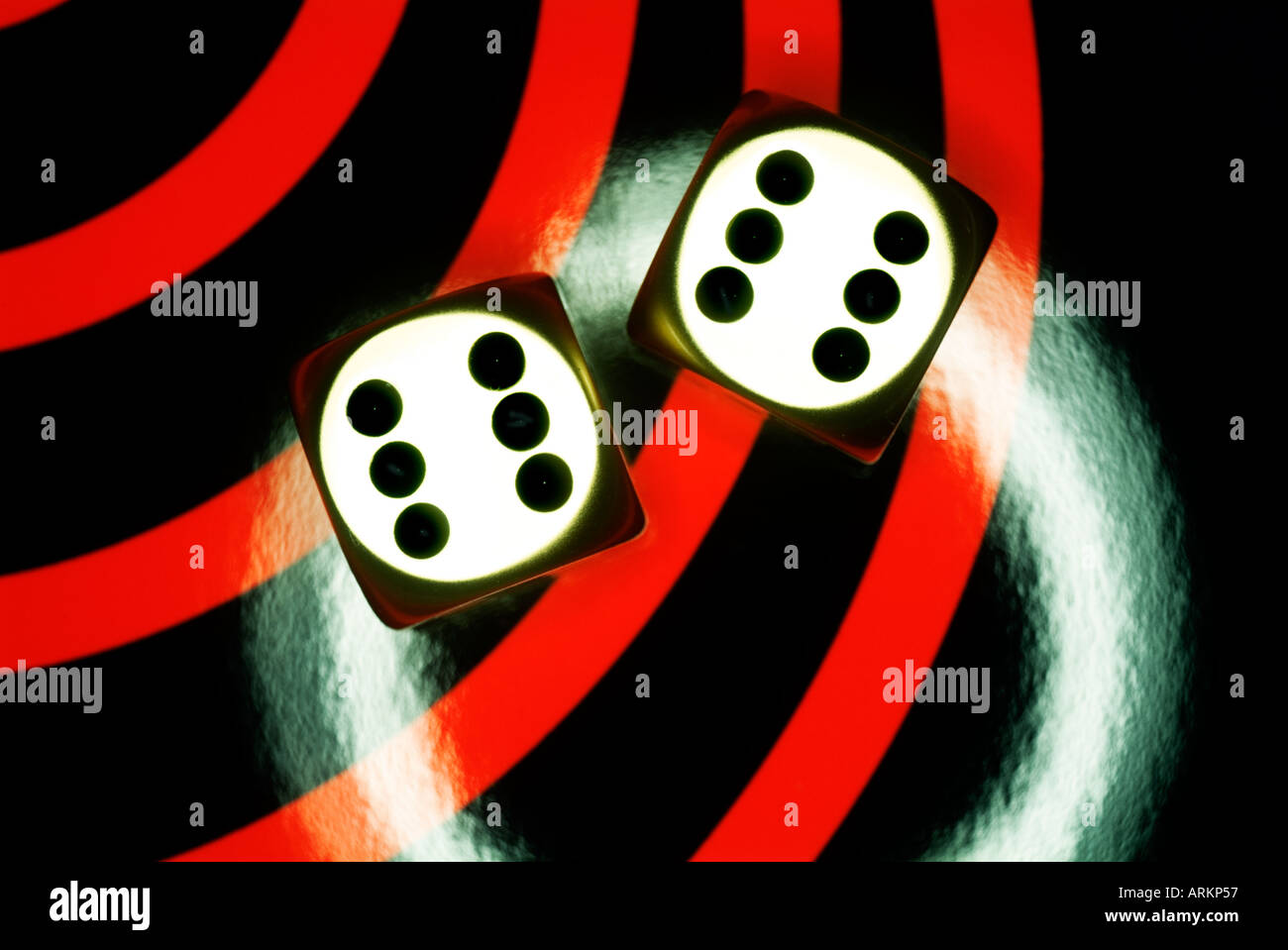 two metal dice on contemporary red and black background Stock Photo