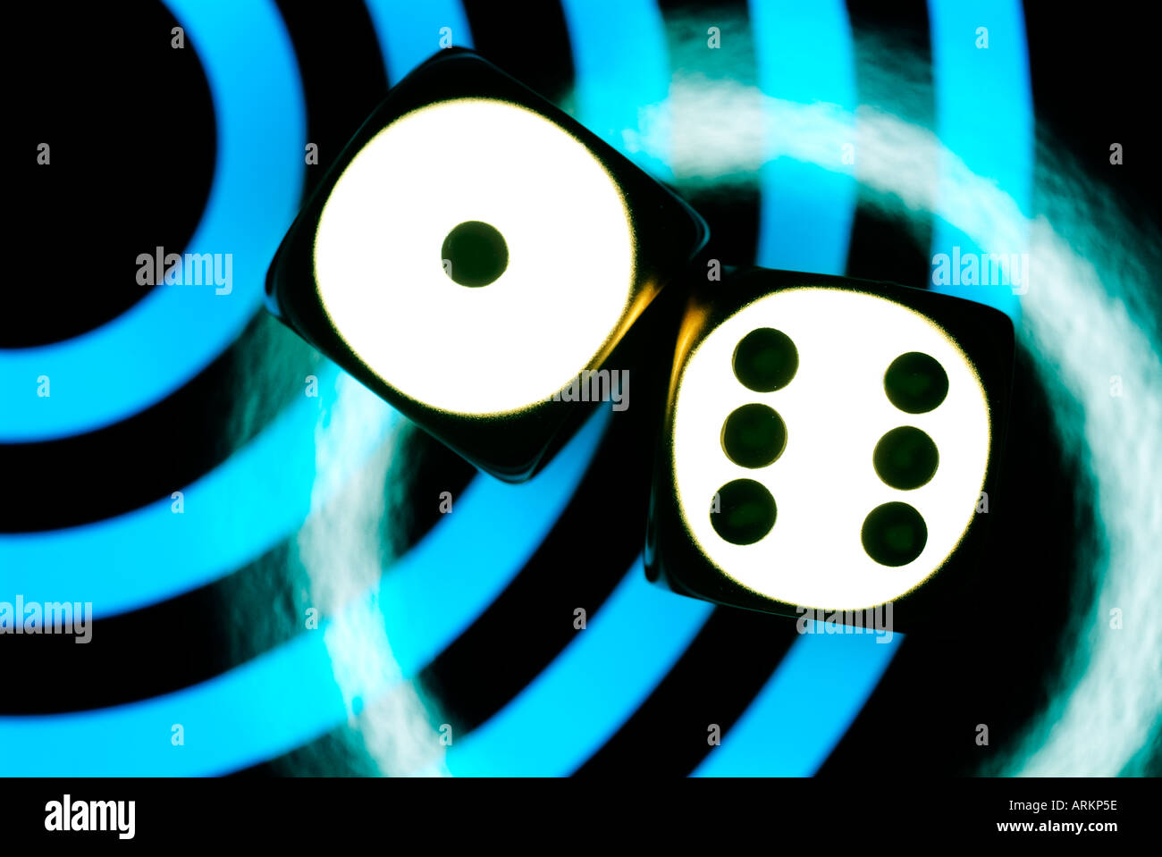 two metal dice on contemporary blue and black background Stock Photo