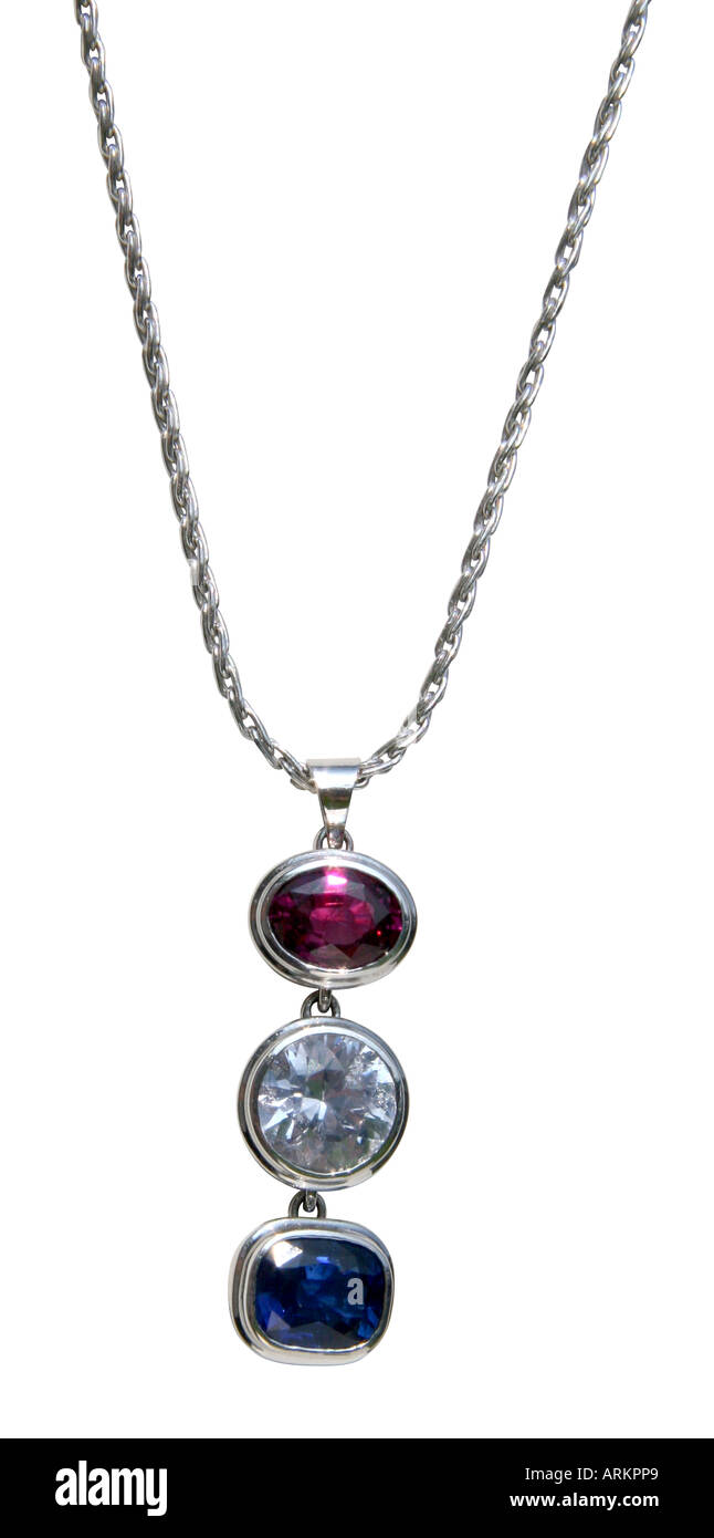 Three stone sapphire pendant showing blue, white, and red jewels. Stock Photo
