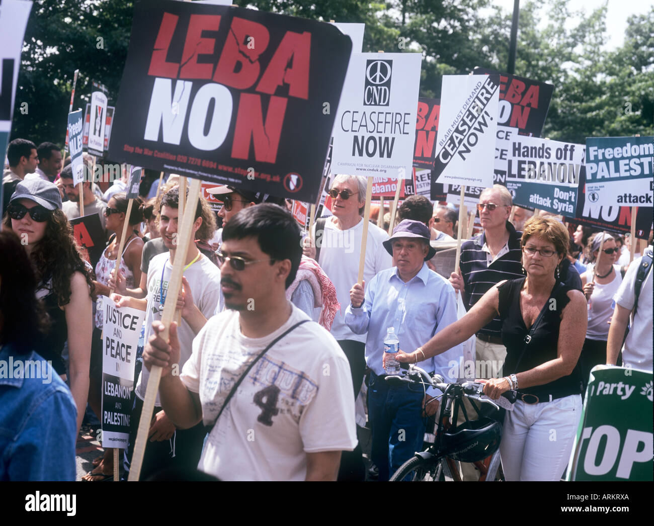 Protesters marching in a demonstration against Israel's Attack on Lebanon. London 5 August 2006. Stock Photo