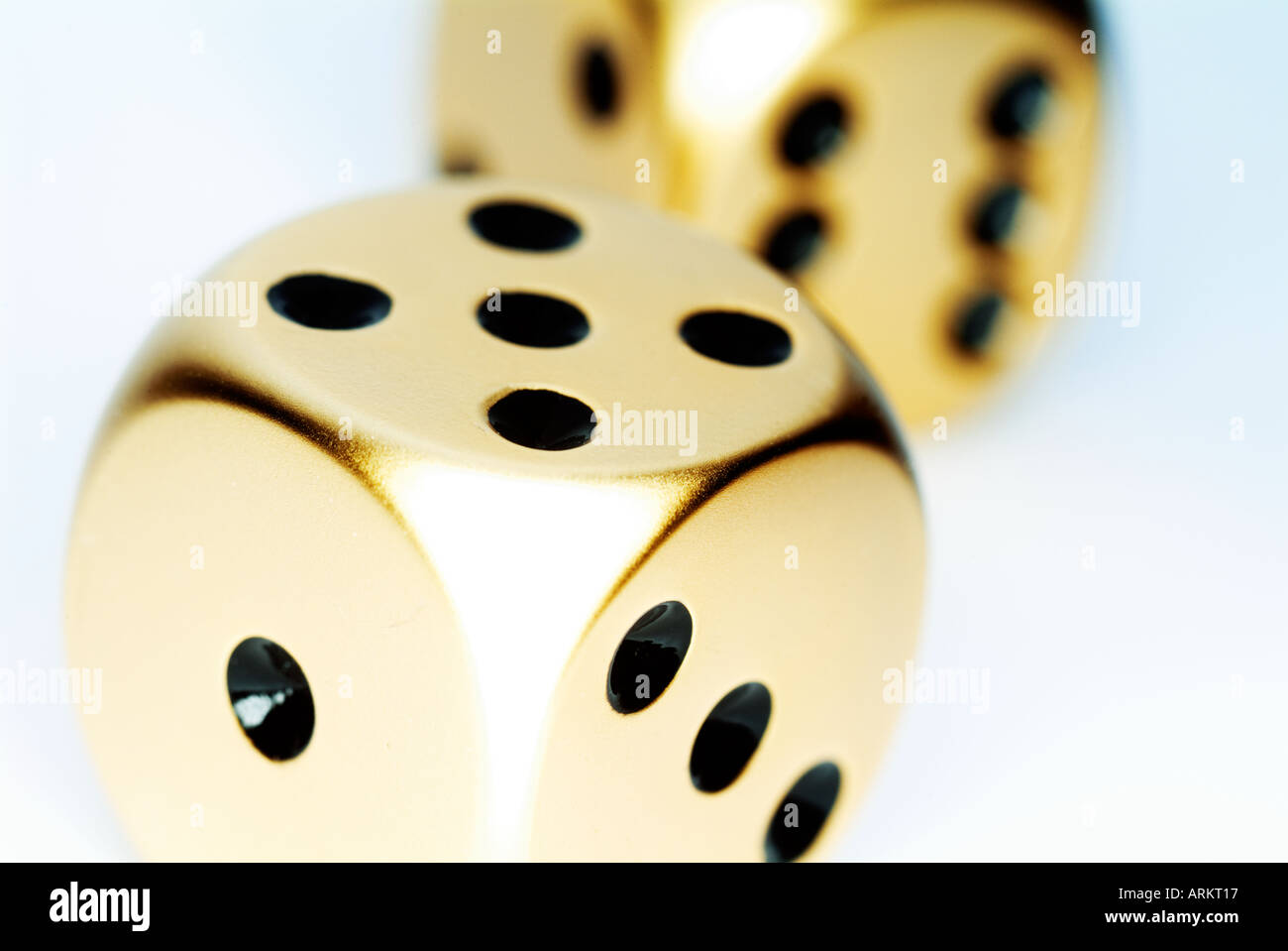two gold dice Stock Photo