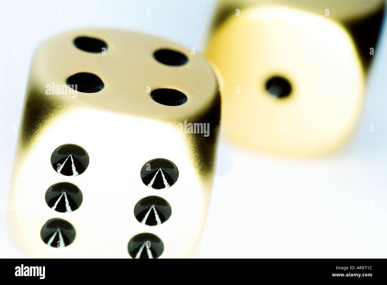 two gold dice Stock Photo