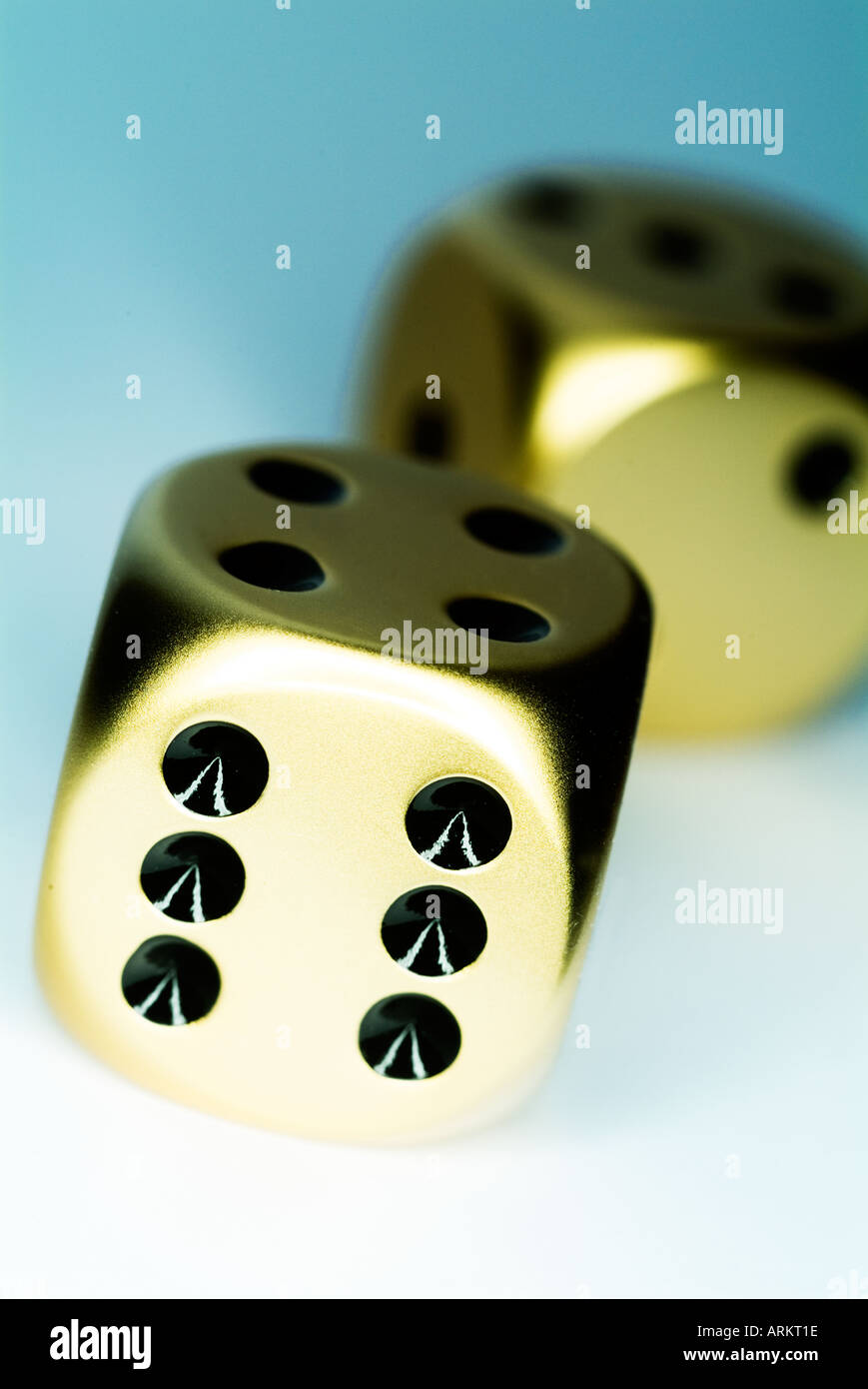 two gold dice Stock Photo