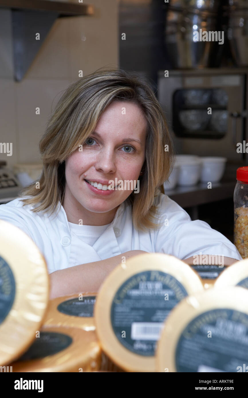 lady cook with her display of Christmas puddings Stock Photo Alamy