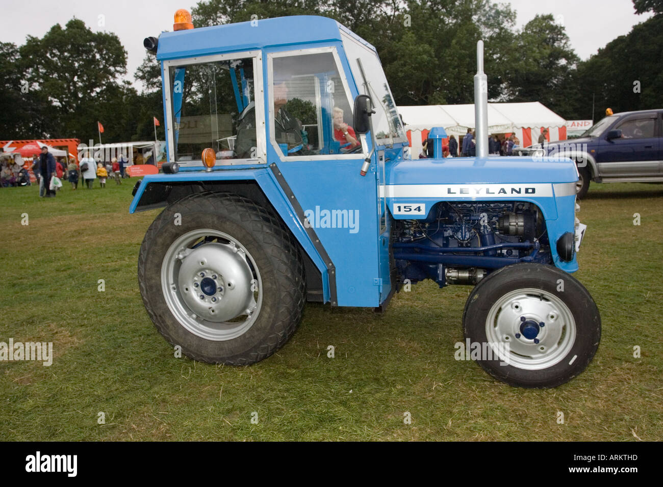 Old blue Leyland tractor with cab at Moreton in Marsh agricultural show September 2005 Cotswolds UK Stock Photo