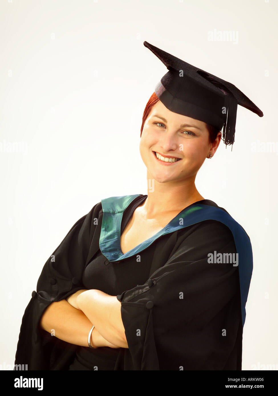 Female student in graduation gown and cap, smiling Stock Photo - Alamy