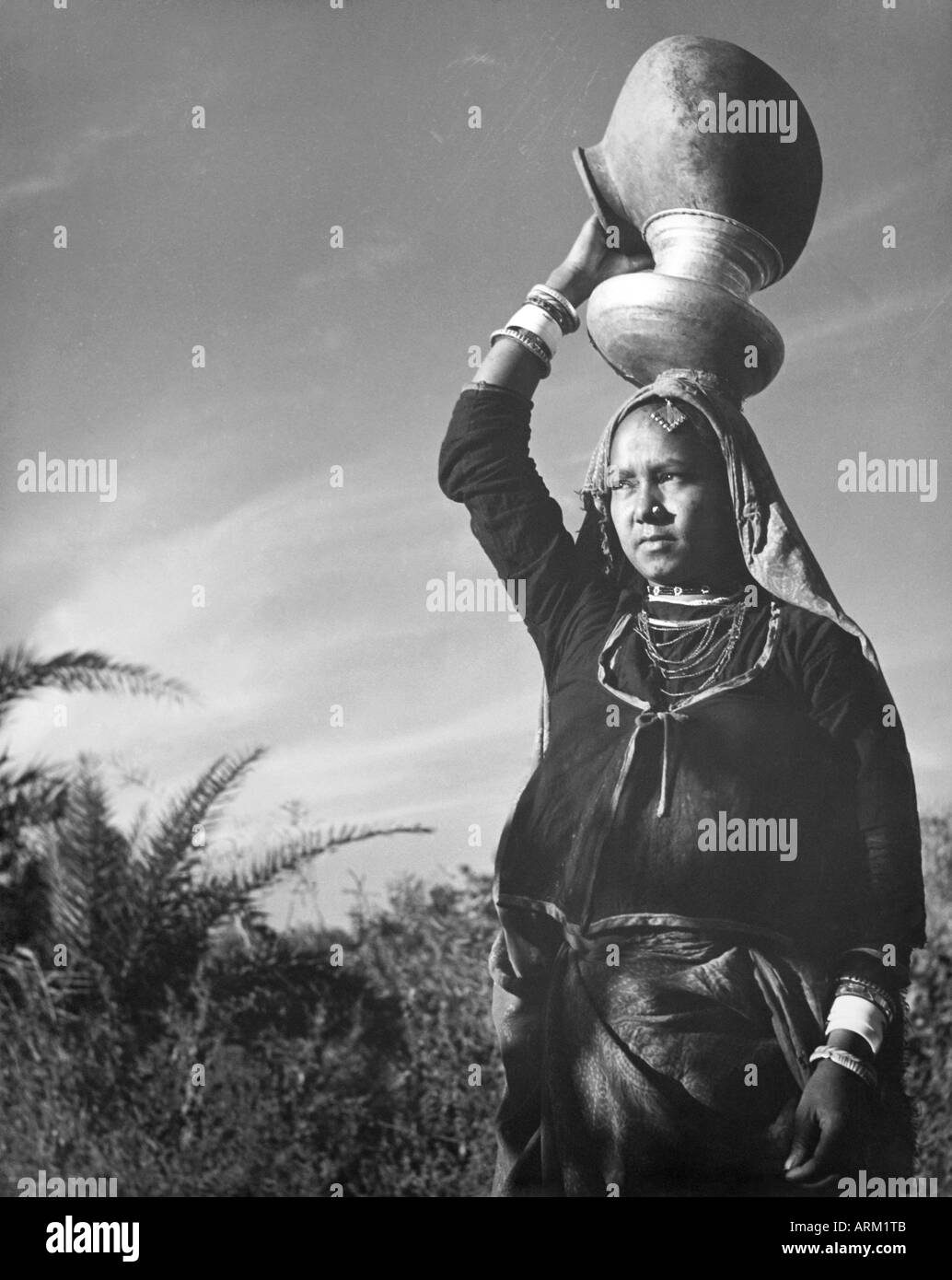 VRB101442 Indian woman with water pot on head at Rajasthan India 1940 s Stock Photo