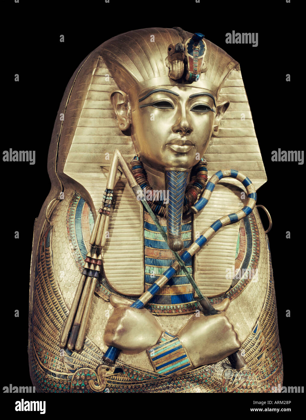 Mummiform coffin of gold with inlaid semi-precious stones, depicting the god Osiris, from the tomb of the pharaoh Tutankhamun Stock Photo
