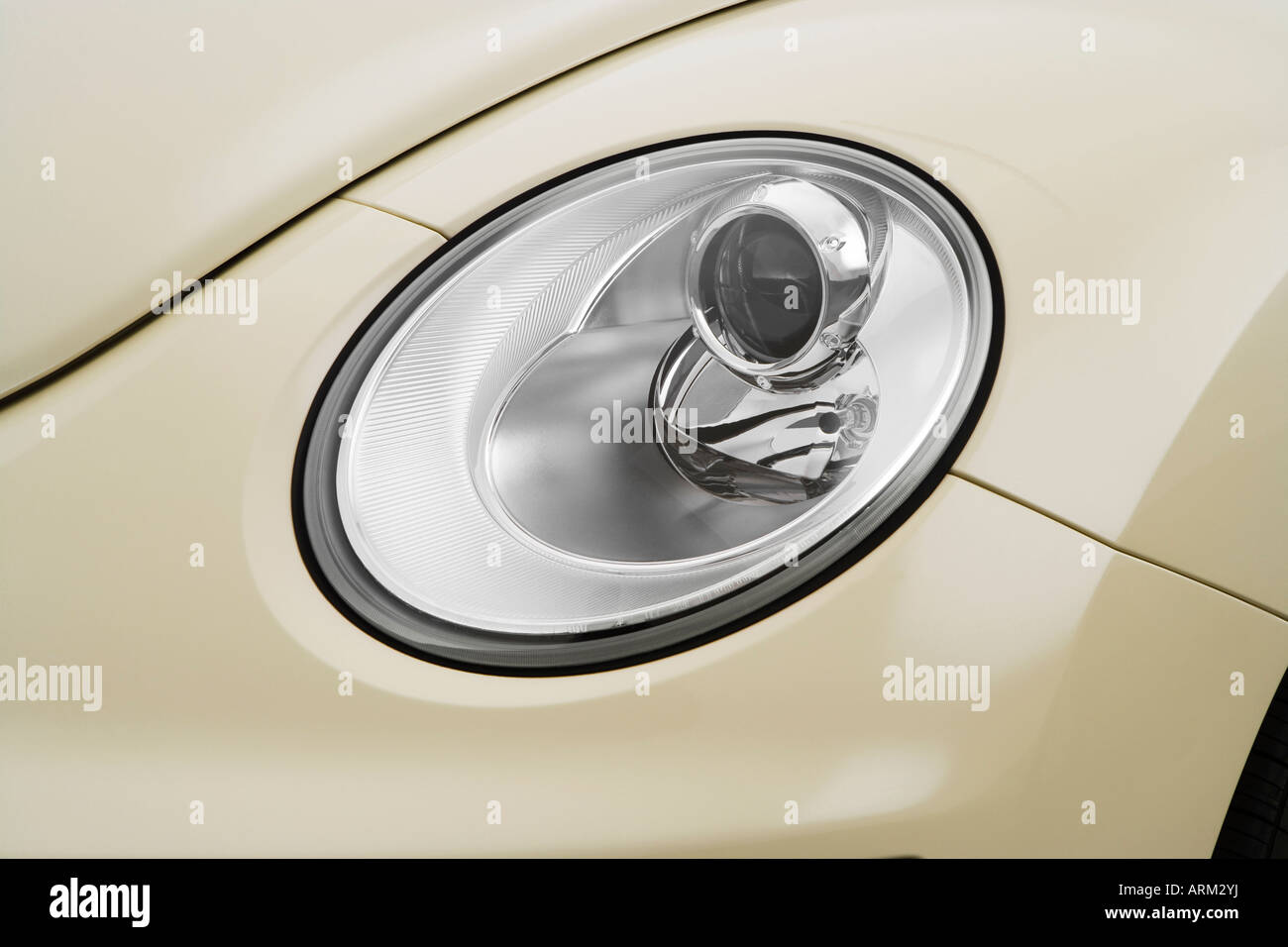 2008 Volkswagen New Beetle S in Beige - Headlight Stock Photo