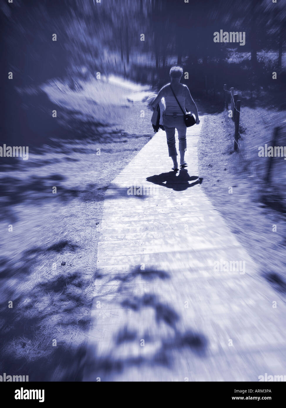Woman alone on pathway hi-res stock photography and images - Alamy