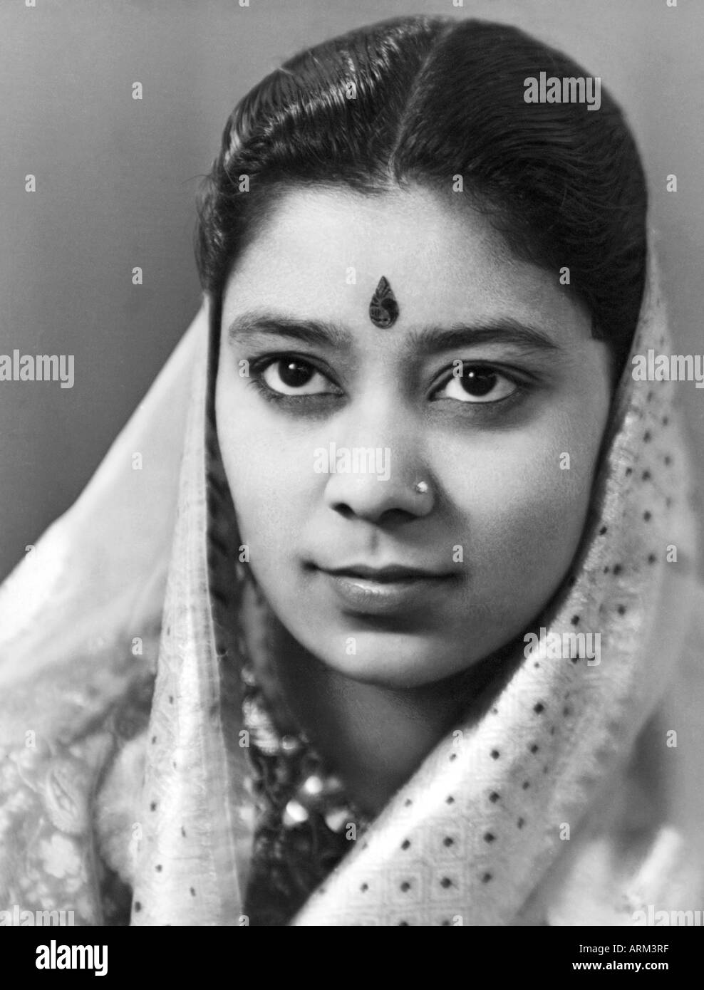 Indian woman in saree with forehead bindi and head covered sari Stock Photo