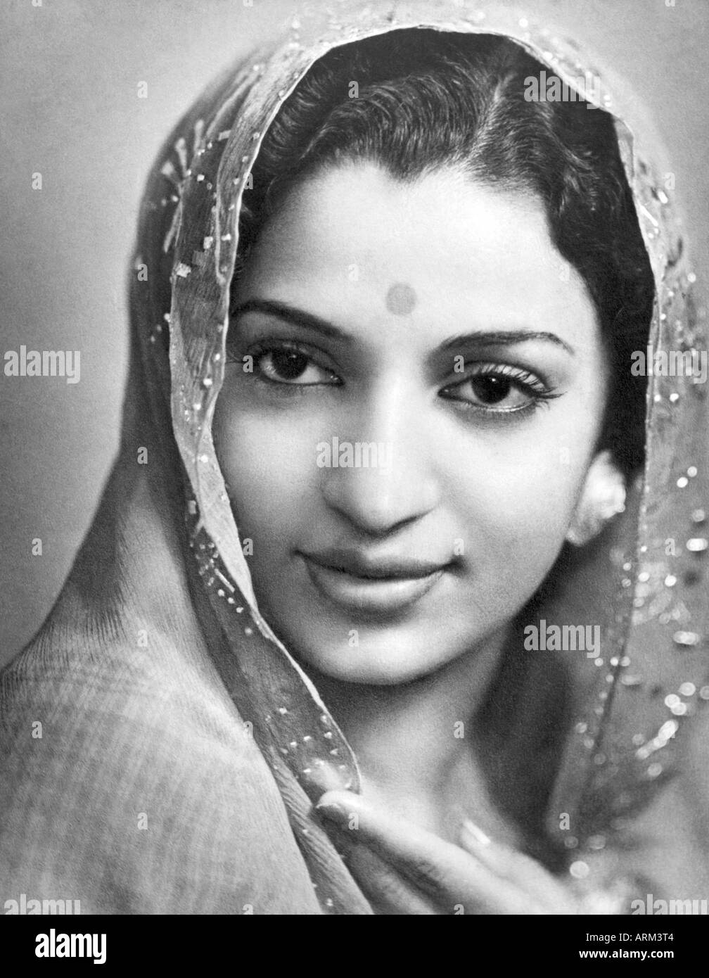 VRB101309 Indian woman in saree bindi head covered portrait in studio Kulri Mussorie Uttar Pradesh India 1940s Stock Photo