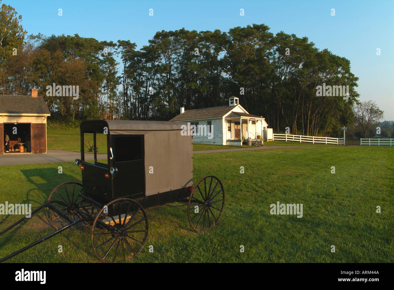 Old Amish Farm Buggy and School House in Lancaster Pennsylvania Stock Photo