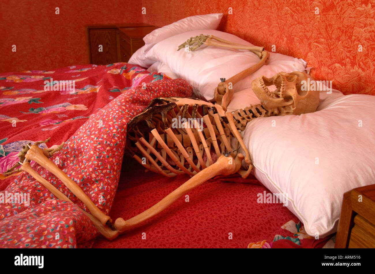 A SKELETON IN BED Stock Photo