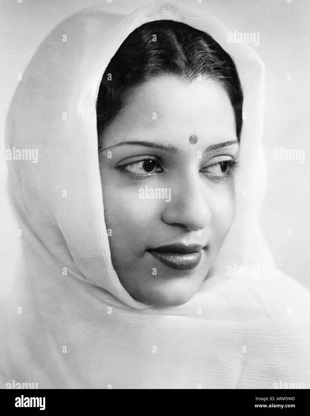 Old vintage Indian woman in saree bindi on forehead portrait in studio Mussoorie Uttar Pradesh India 1940s Stock Photo