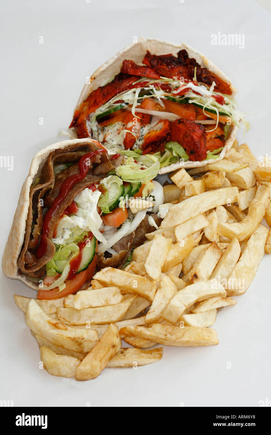 Lamb doner kebab and chicken kebab in pitta with salad and chips Stock