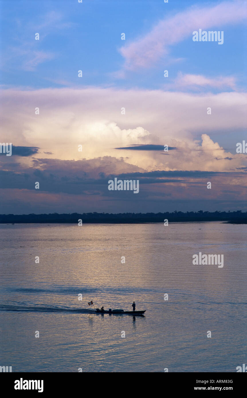 Small fishing boat moving down giant river, Amazon River, Peru, South America Stock Photo