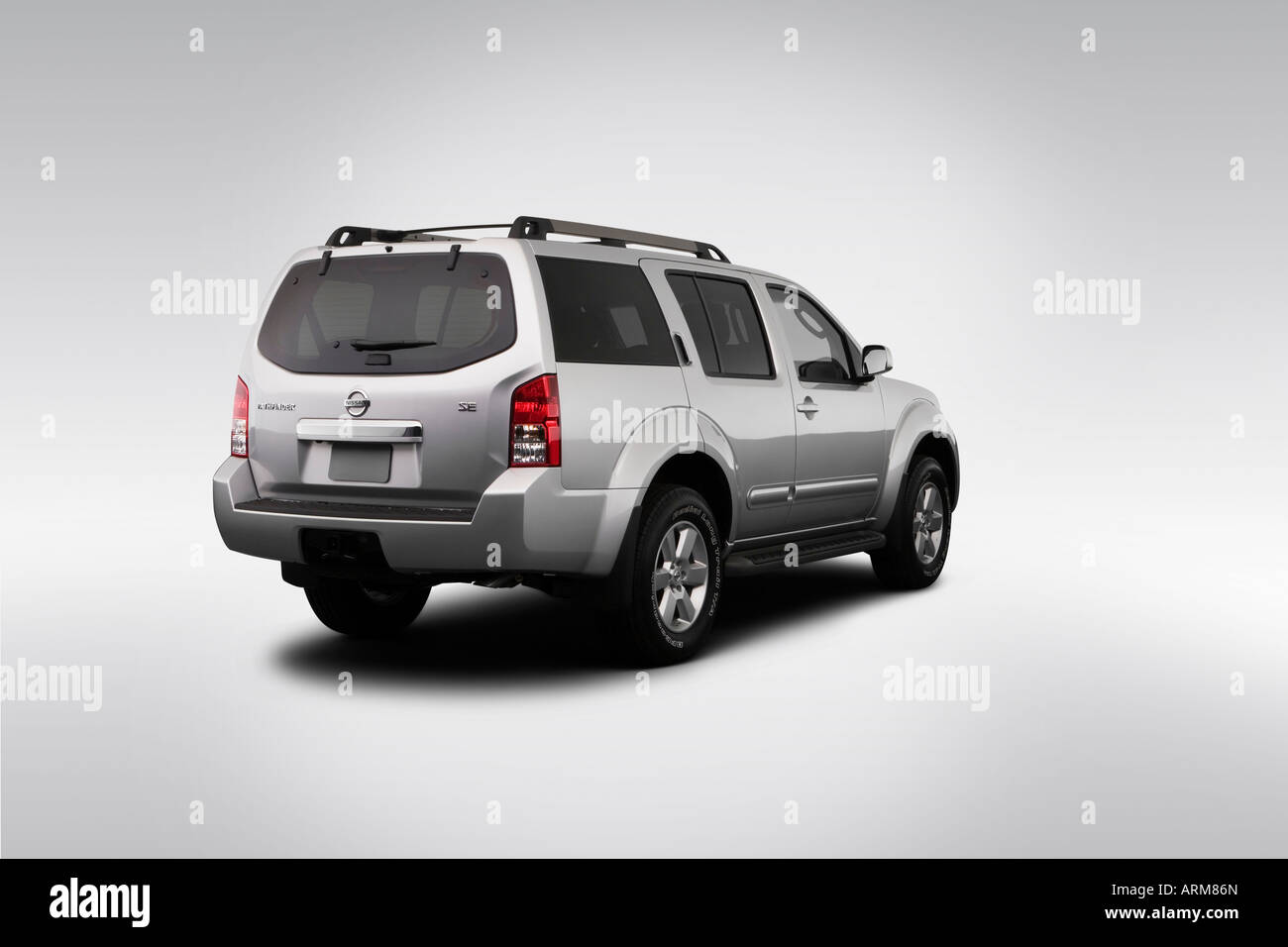 2008 Nissan Pathfinder SE in Silver - Rear angle view Stock Photo