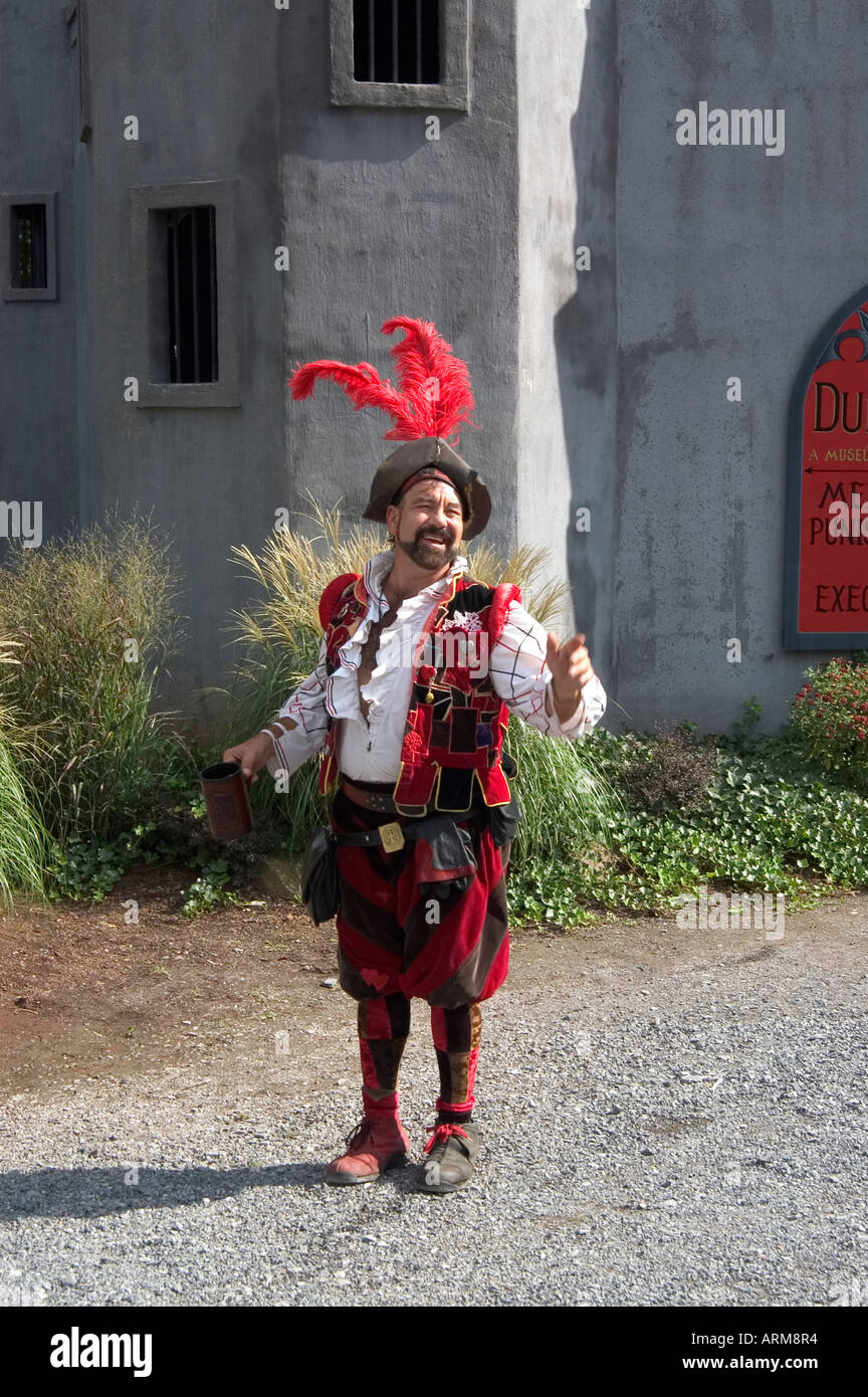 Man in colourful ancient costume speaking on the street, Renaissance