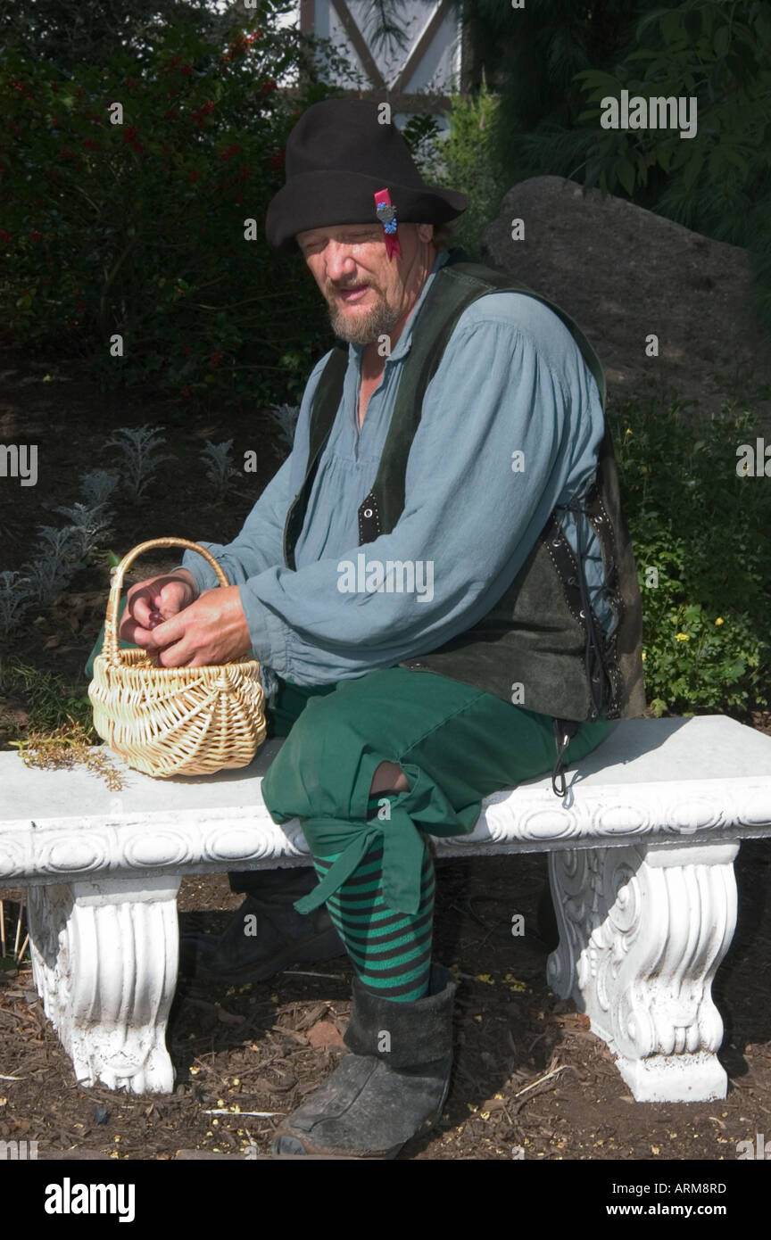 Peasant with basket sitting on the bench, Renaissance Fair,Pennsylvania ...