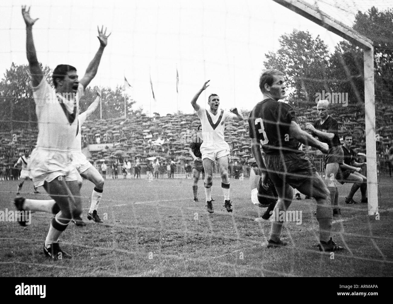 football, Regionalliga West, 1965/1966, Fortuna Duesseldorf versus Wuppertaler SV 2:1, Rhein Stadium in Duesseldorf, scene of the match, 2:1 winning goal to Duesseldorf by Willi Marzok (not pictured), f.l.t.r. Werner Biskup (Ddorf), Reinhold Straus (Ddorf Stock Photo