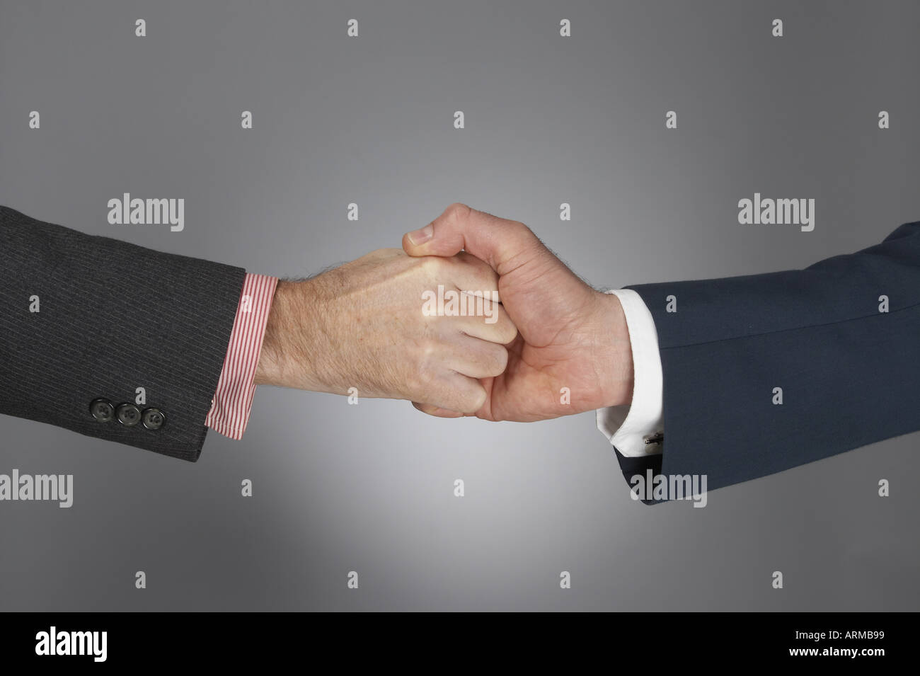 Strong finger grip handshake of hand and fingers of two corporate business  men in suits gesture of complex teamwork working together and partnership  Stock Photo - Alamy