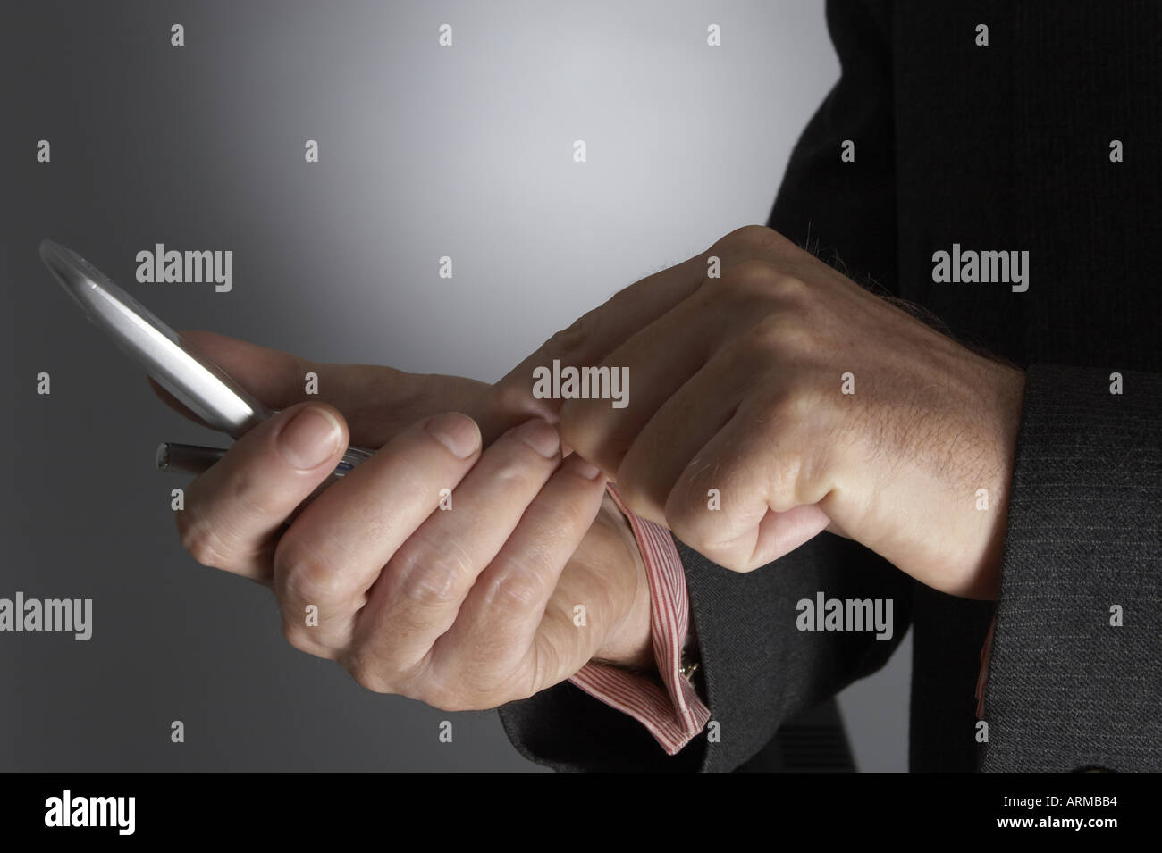 Corporate business man in suit dialling and making phone call on mobile ...