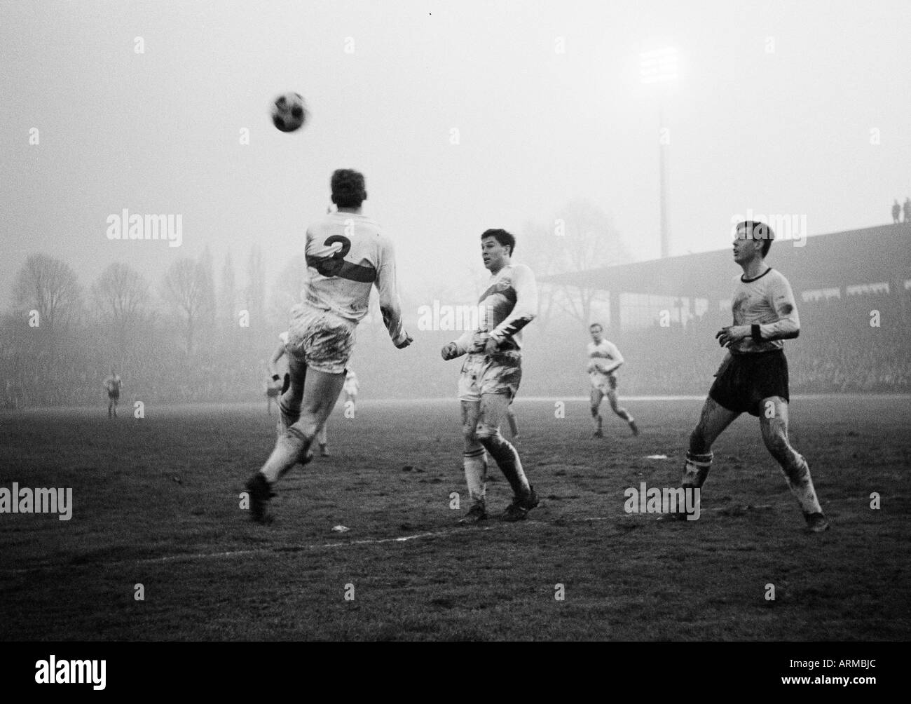 football, Bundesliga, 1965/1966, Borussia Dortmund versus VfB Stuttgart 4:0, Stadium Rote Erde, scene of the match, f.l.t.r. two Stuttgart players, Lothar Emmerich (BVB) Stock Photo