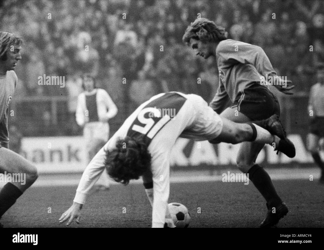 football, friendly game, 1972, Rhine Stadium in Duesseldorf, select team of Fortuna Duesseldorf and Borussia Moenchengladbach versus Ajax Amsterdam 1:1, scene of the match, f.l.t.r. Guenter Netzer (Gladbach), Arie Haan (Ajax, 15), Dieter Herzog (Ddorf) Stock Photo