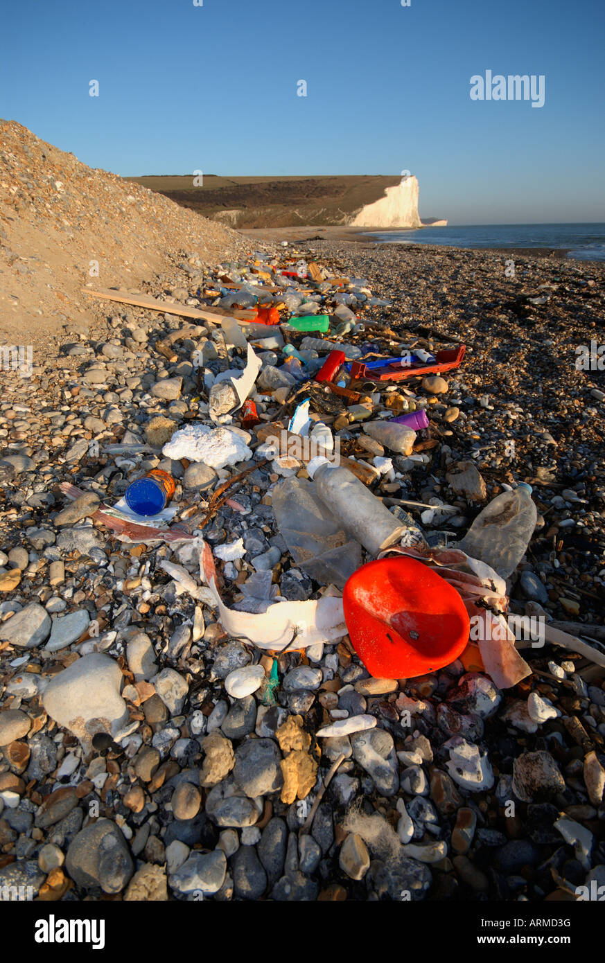 Rubbish and garbage is strewn on the beach at low tide Stock Photo