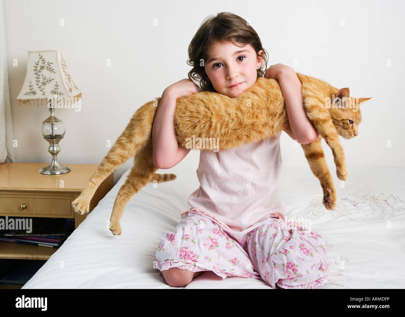 girl holding cat in arms Stock Photo