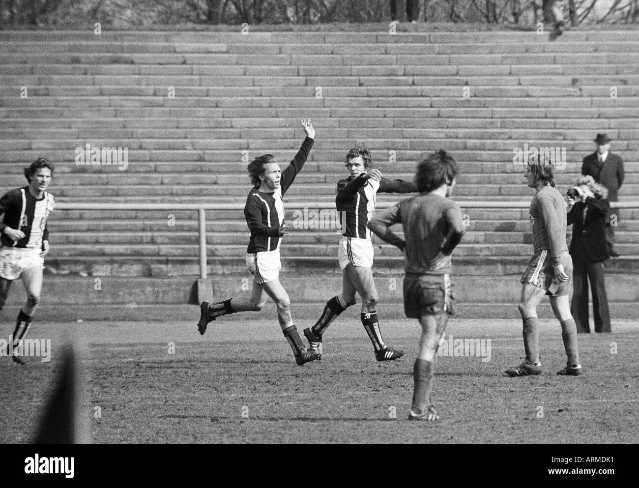 football, Regionalliga West, 1973/1974, Eintracht Gelsenkirchen versus 1. FC Muelheim 4:2, Sued Stadium Gelsenkirchen, Muelheim players rejoice at the 1:1 equaliser goal, f.l.t.r. Heiner Pottgiesser (Muelheim), goal scorer Herbert Bals (Muelheim), Holger Stock Photo